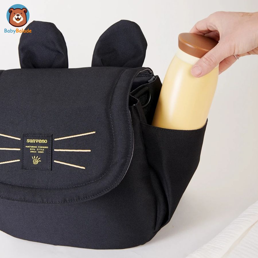 sac à langer poussette de couleur noir avec un emplacement bouteille sur le côté